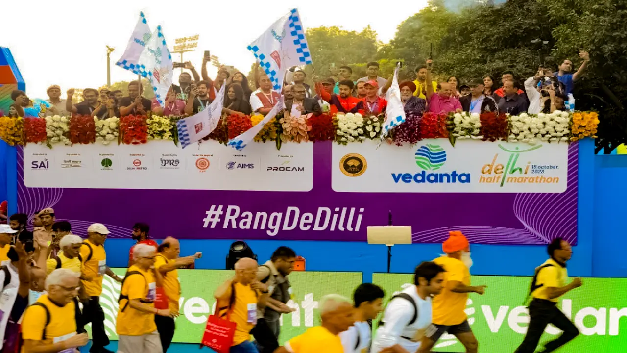 Visual hierarchy and staging for VDHM 2023 flag-off, aligning sponsor branding, audience engagement, and event optics