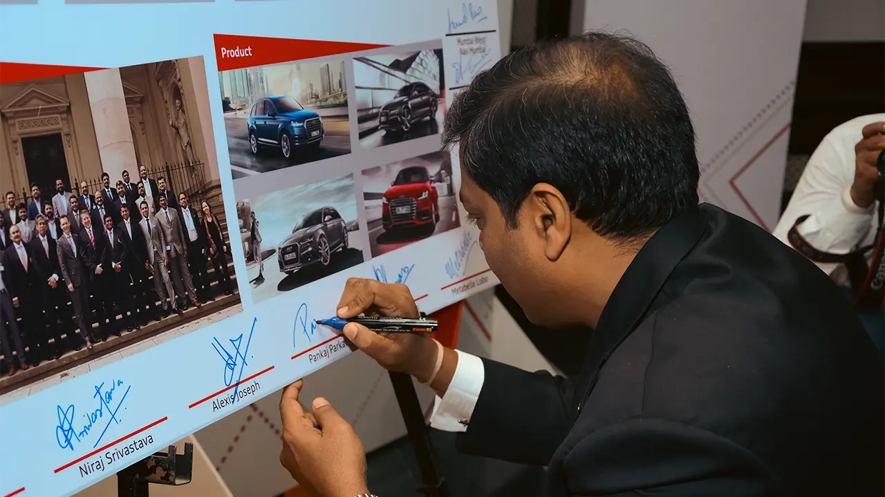 Audi brand engagement activity capturing guest participation during leadership conference to reinforce partnership and product alignment