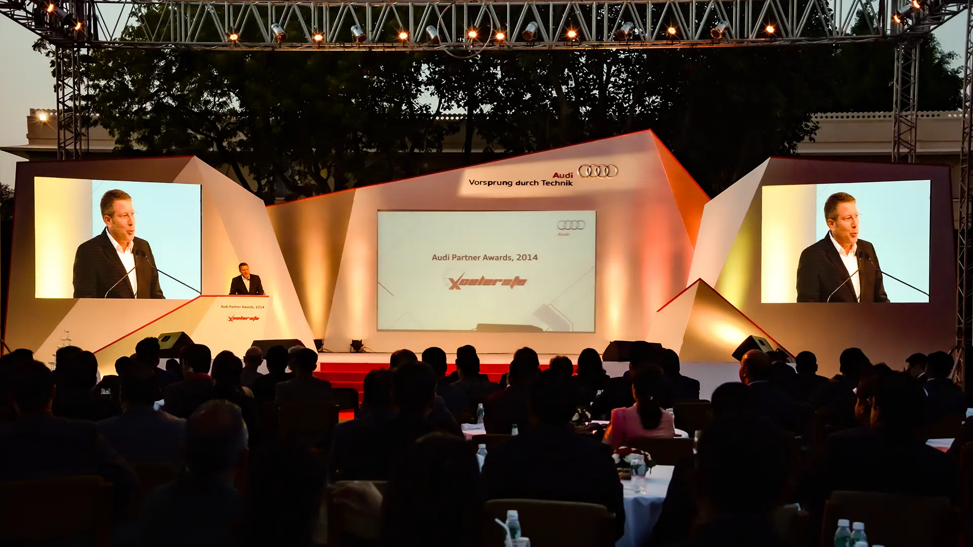 Stage design at Audi Partner Awards 2014 with angular panels and LED backdrop
