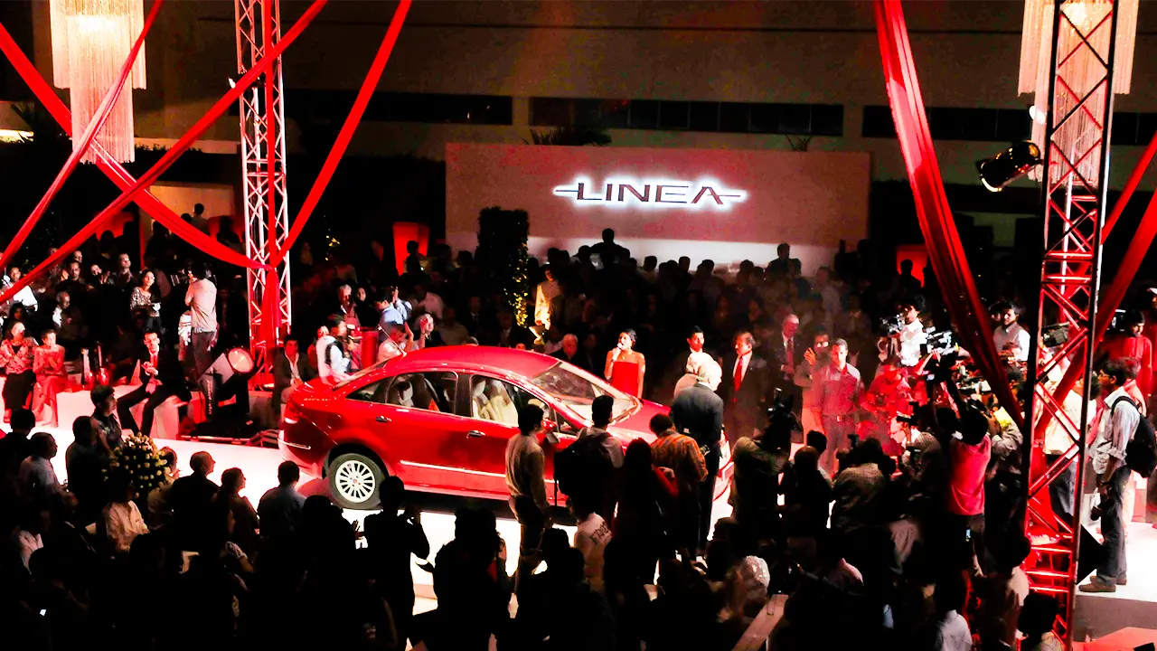 Fiat Linea car reveal at launch event, showcasing product strategy and brand experience design