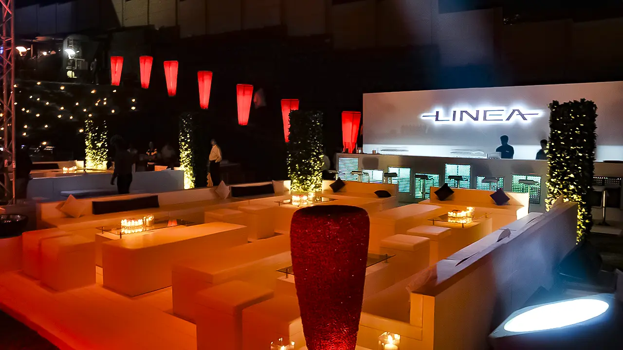 Fiat Linea launch lounge setup with ambient lighting and branded bar, showcasing luxury staging and experiential design