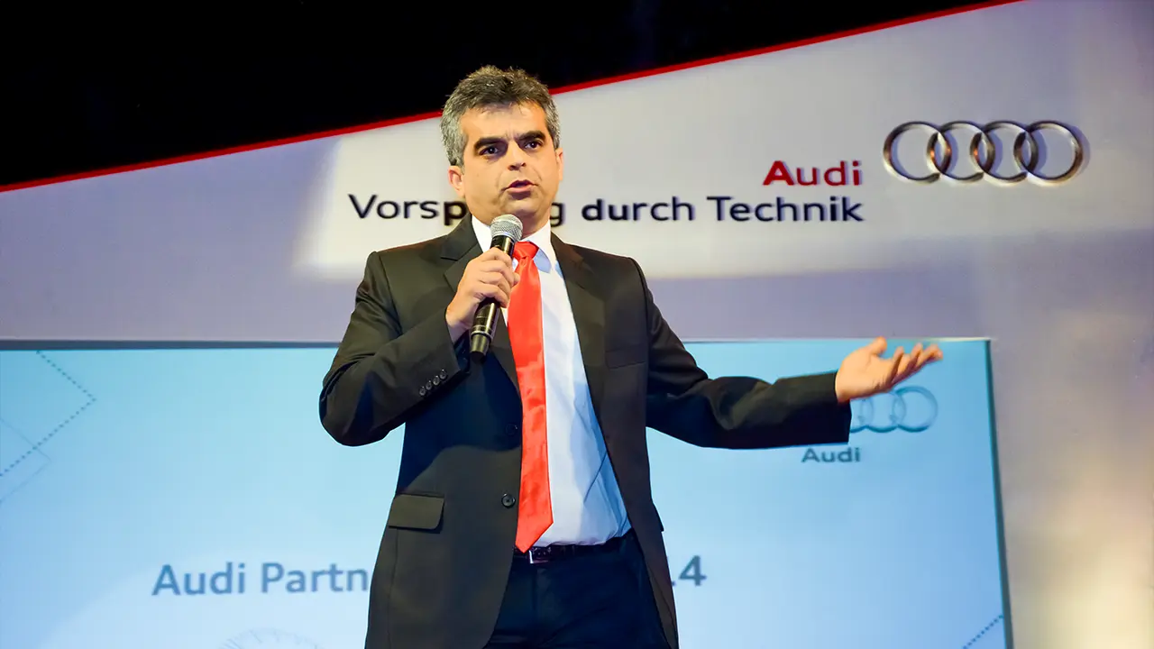Stand-up comedy act by Atul Khatri at Audi Partner Awards demonstrating audience engagement and brand storytelling