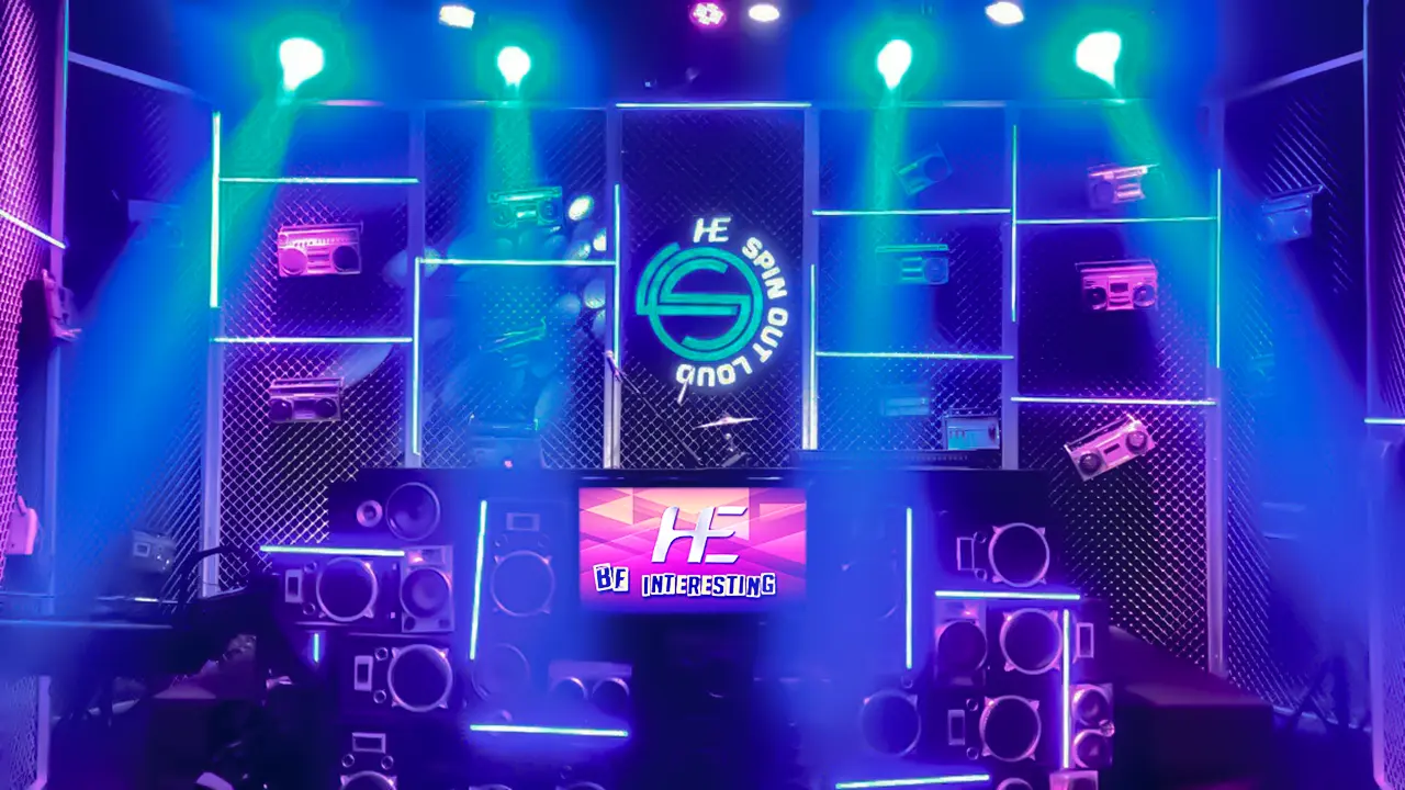 HE Spin Out Loud DJ studio set styled with retro boomboxes, neon accents, and immersive lighting