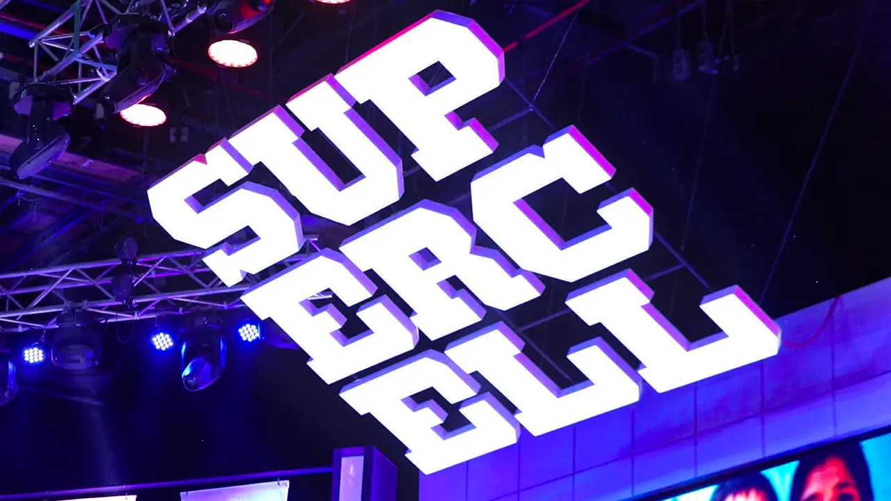 Supercell #SuperFest truss-mounted 3D logo signage suspended above the stage with blue uplighting and rig detail