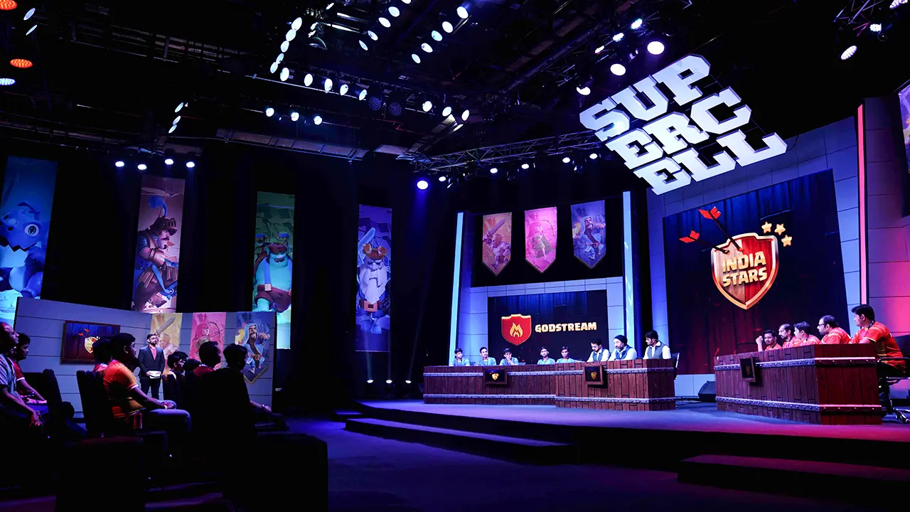 Supercell #SuperFest set design with India Stars and Godstream teams on stage under game-themed lighting and oversized brand signage