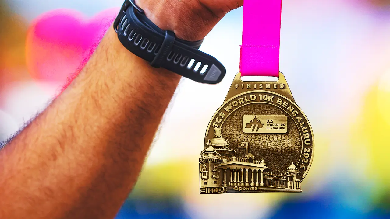 Finisher medal for TCS World 10K Bengaluru, showcasing city architecture, identity-led branding, and product design flair